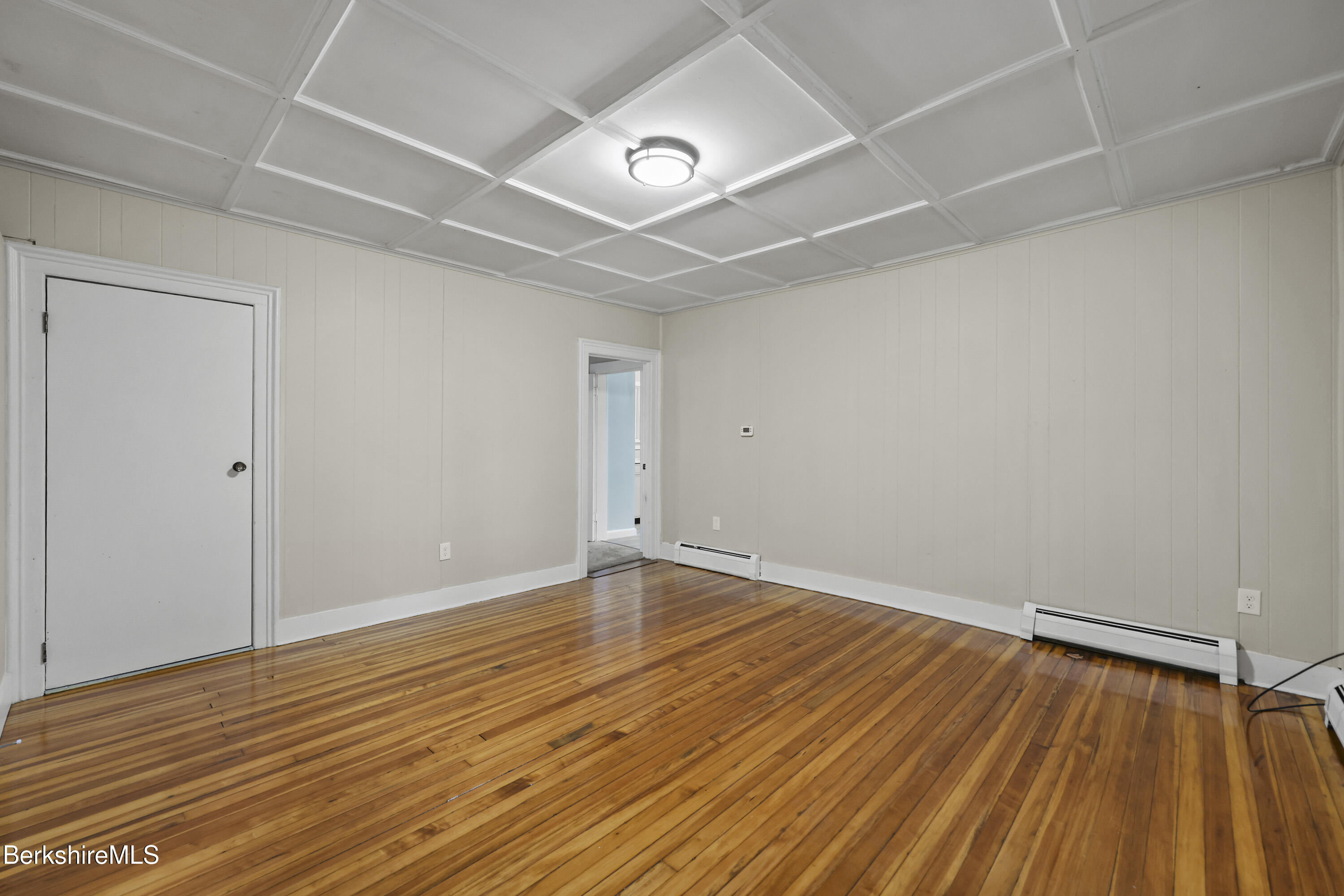 41-43 Reed Street Pittsfield, MA 01201 - Photo 10 of 56 a view of an empty room with wooden floor