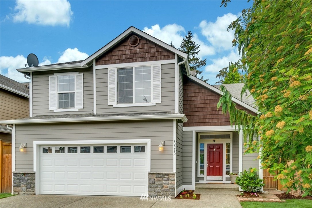 19212 1st Avenue West Bothell, WA 98012 - Photo 1 of 22 a front view of a house with a yard