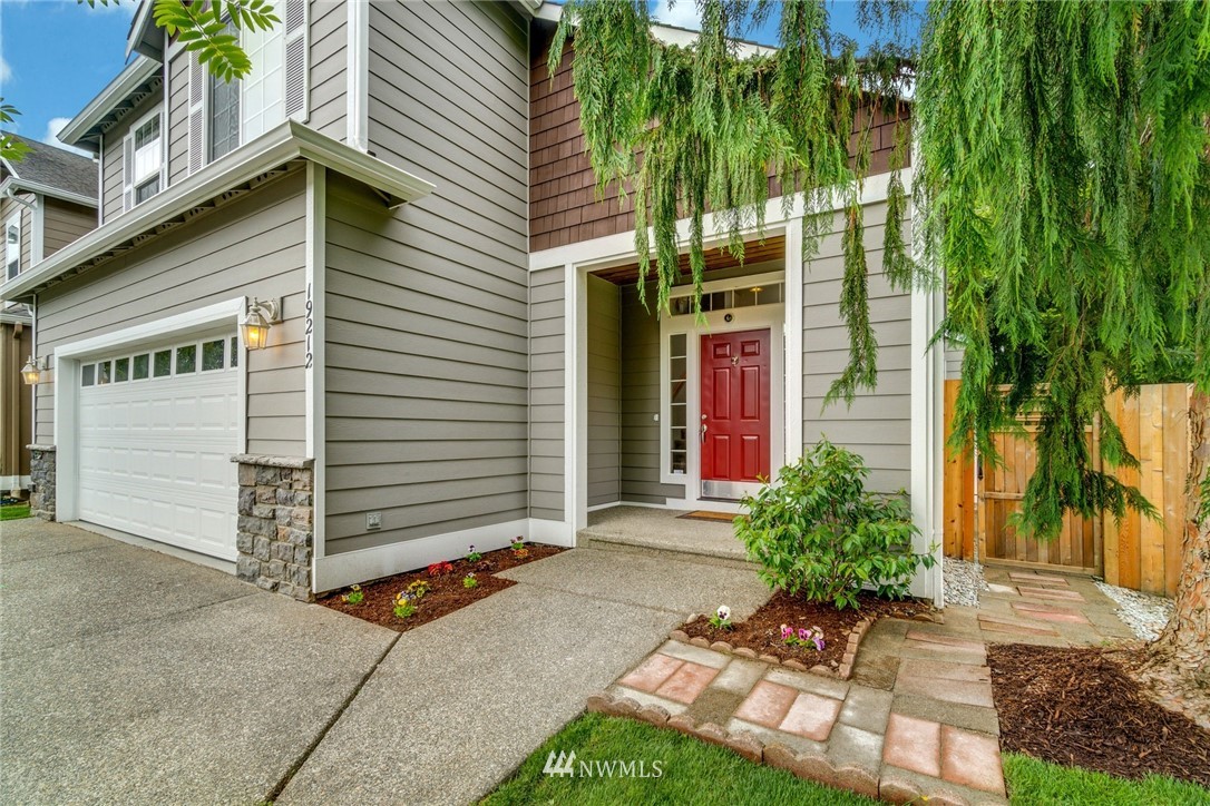 19212 1st Avenue West Bothell, WA 98012 - Photo 2 of 22 a view of a house with a yard