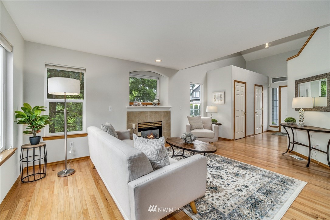 19212 1st Avenue West Bothell, WA 98012 - Photo 11 of 22 a living room with furniture and a fireplace
