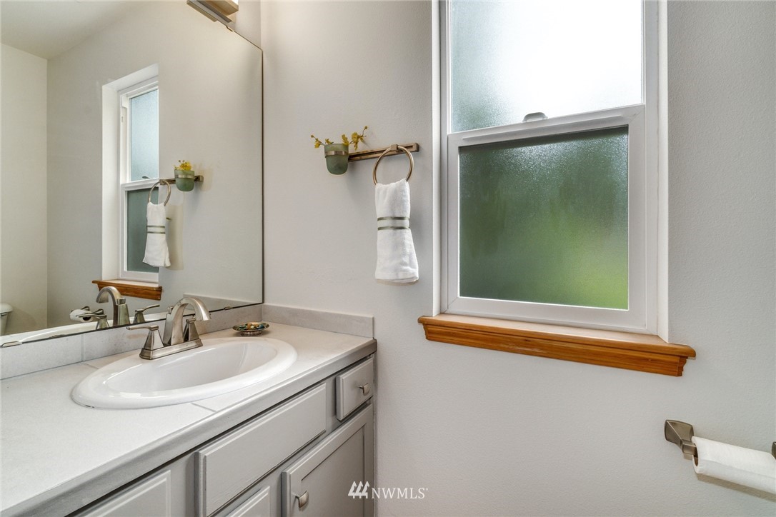19212 1st Avenue West Bothell, WA 98012 - Photo 13 of 22 a bathroom with a sink and mirror