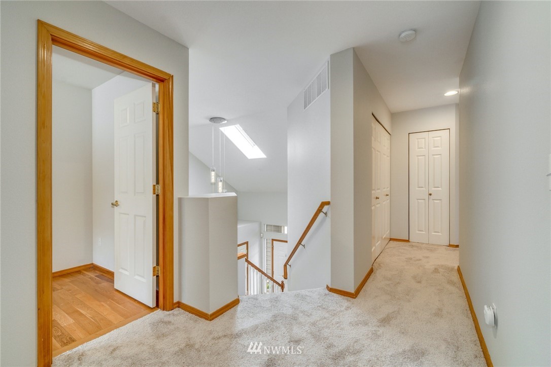 19212 1st Avenue West Bothell, WA 98012 - Photo 14 of 22 a view of a hallway to rooms