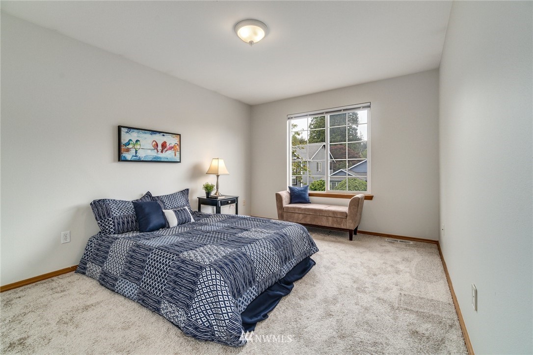 19212 1st Avenue West Bothell, WA 98012 - Photo 18 of 22 a bedroom with a bed and window