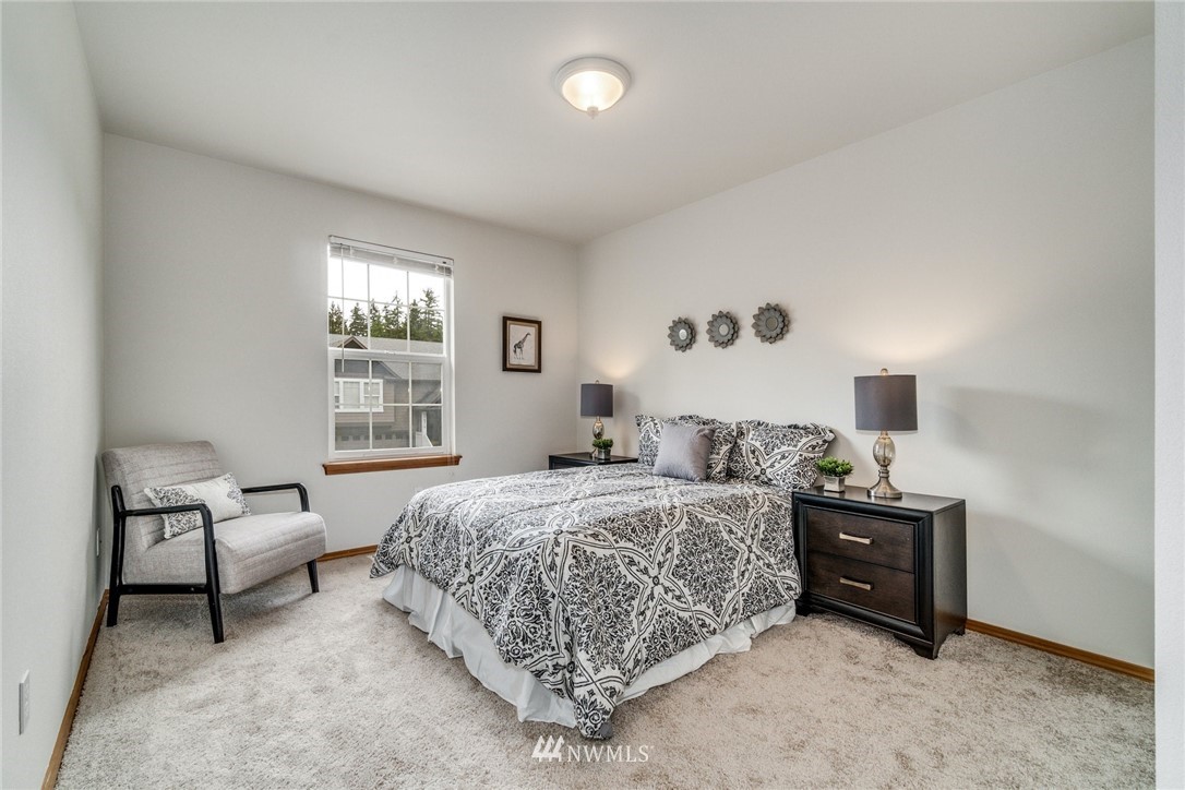 19212 1st Avenue West Bothell, WA 98012 - Photo 19 of 22 a bedroom with a bed and a window