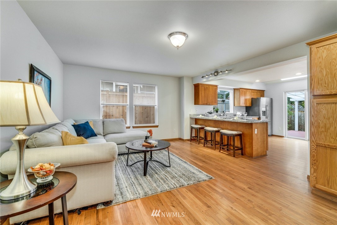 19212 1st Avenue West Bothell, WA 98012 - Photo 5 of 22 a living room with fireplace furniture and a wooden floor