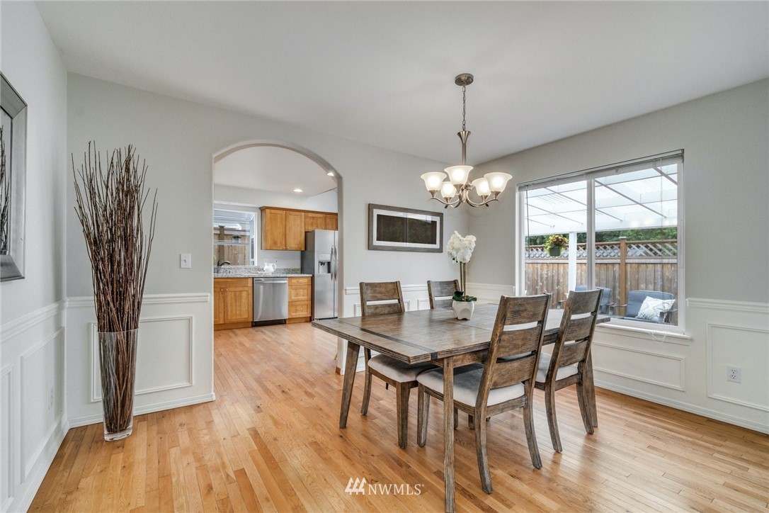 19212 1st Avenue West Bothell, WA 98012 - Photo 6 of 22 a view of a dining room with furniture window and wooden floor