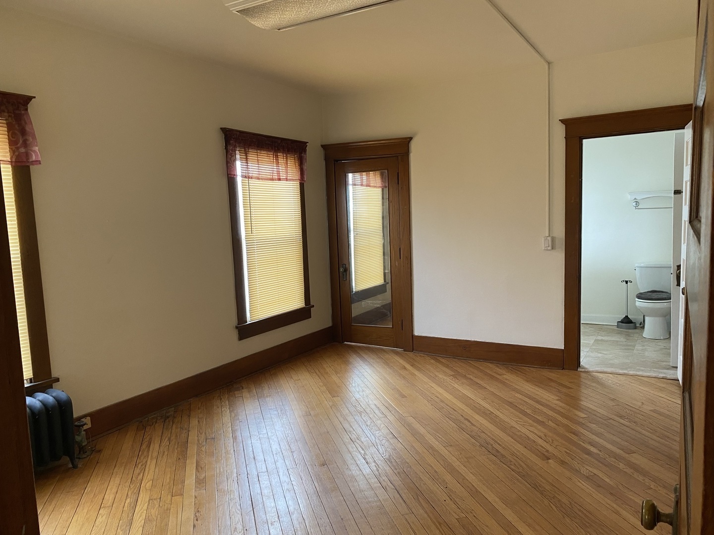 Undisclosed Address Maple Park, IL 60119 - Photo 13 of 27 an empty room with wooden floor and a bathroom