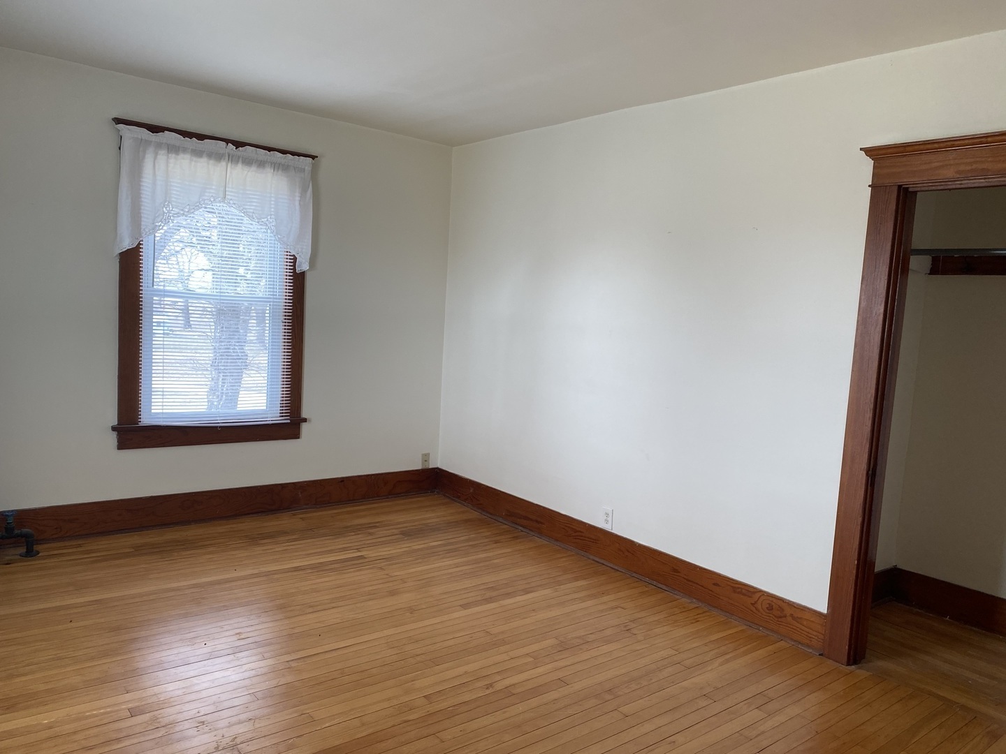 Undisclosed Address Maple Park, IL 60119 - Photo 18 of 27 an empty room with wooden floor and windows