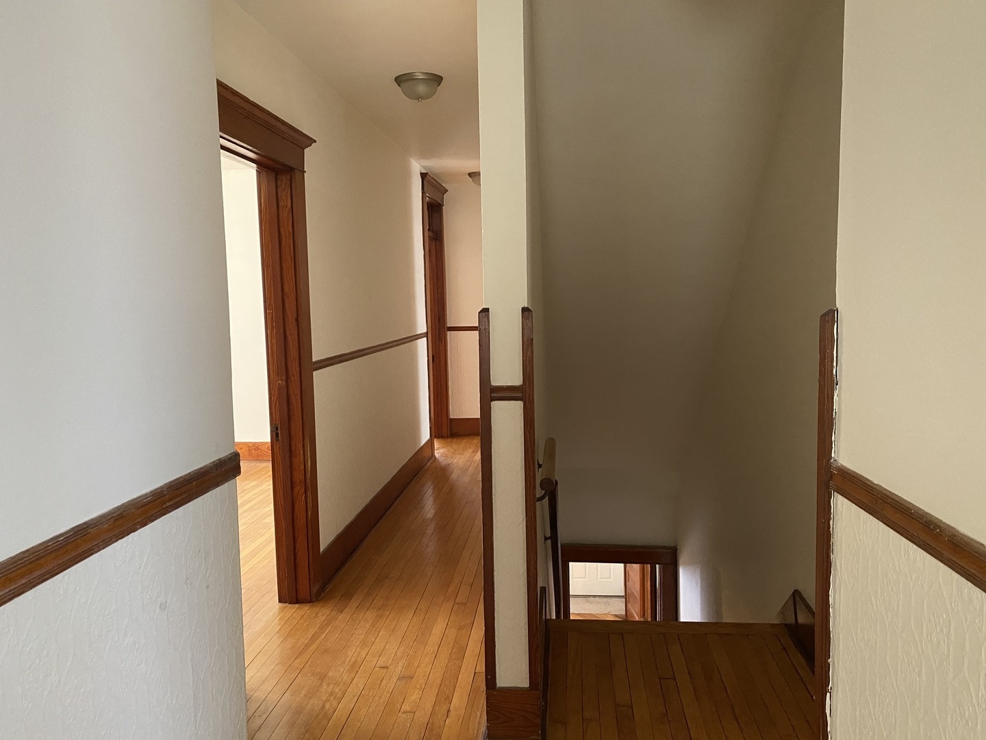 Undisclosed Address Maple Park, IL 60119 - Photo 19 of 27 a view of a hallway with wooden floor and staircase