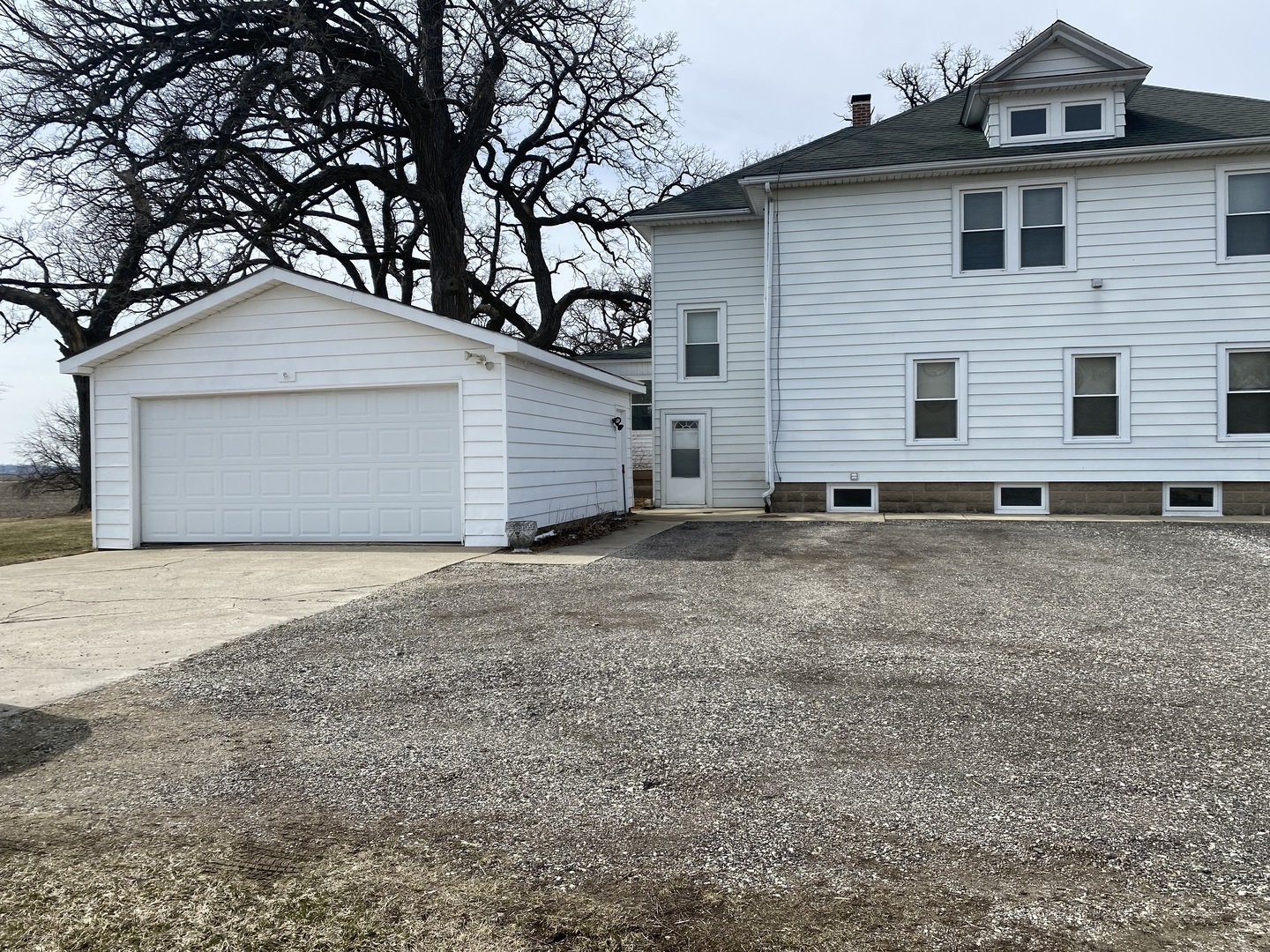Undisclosed Address Maple Park, IL 60119 - Photo 2 of 27 a front view of a house with a yard and garage