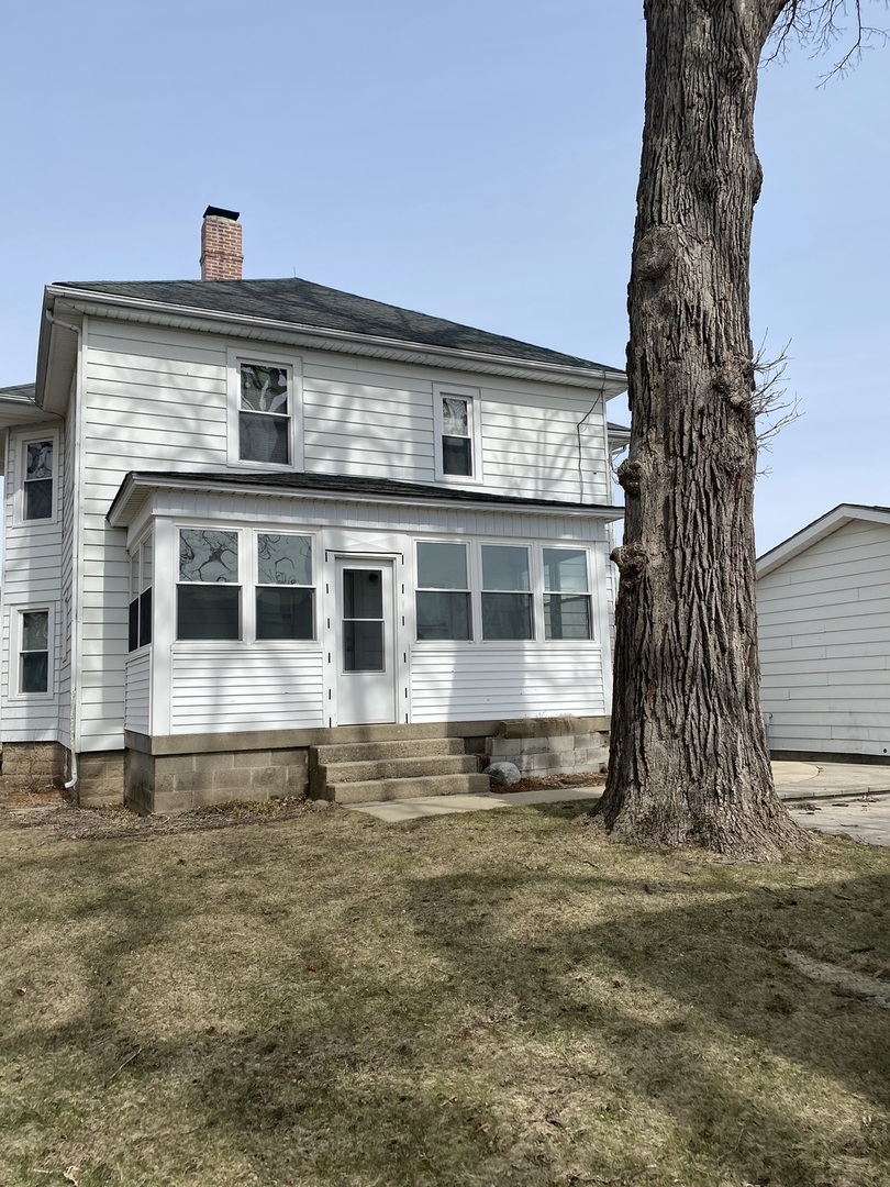 Undisclosed Address Maple Park, IL 60119 - Photo 4 of 27 a front view of a house with a yard