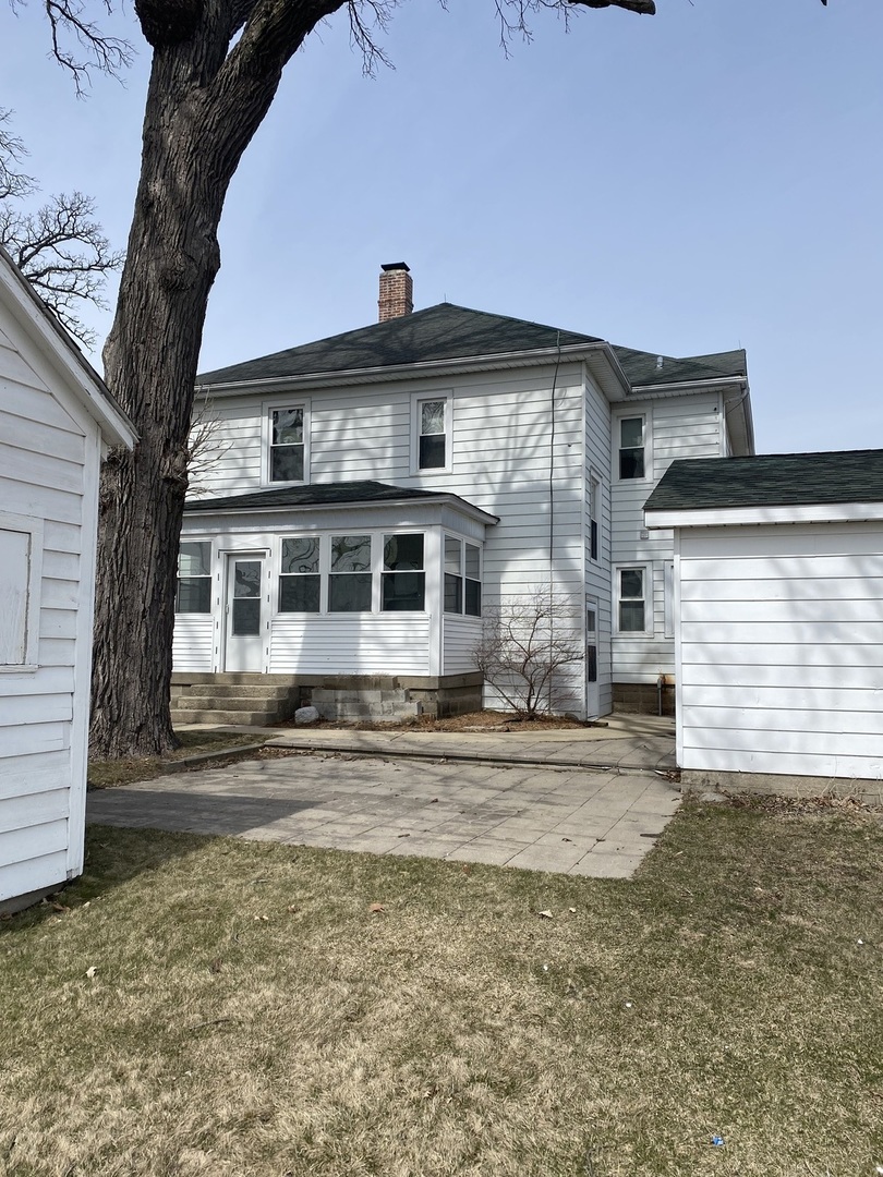 Undisclosed Address Maple Park, IL 60119 - Photo 5 of 27 a front view of a house with a yard