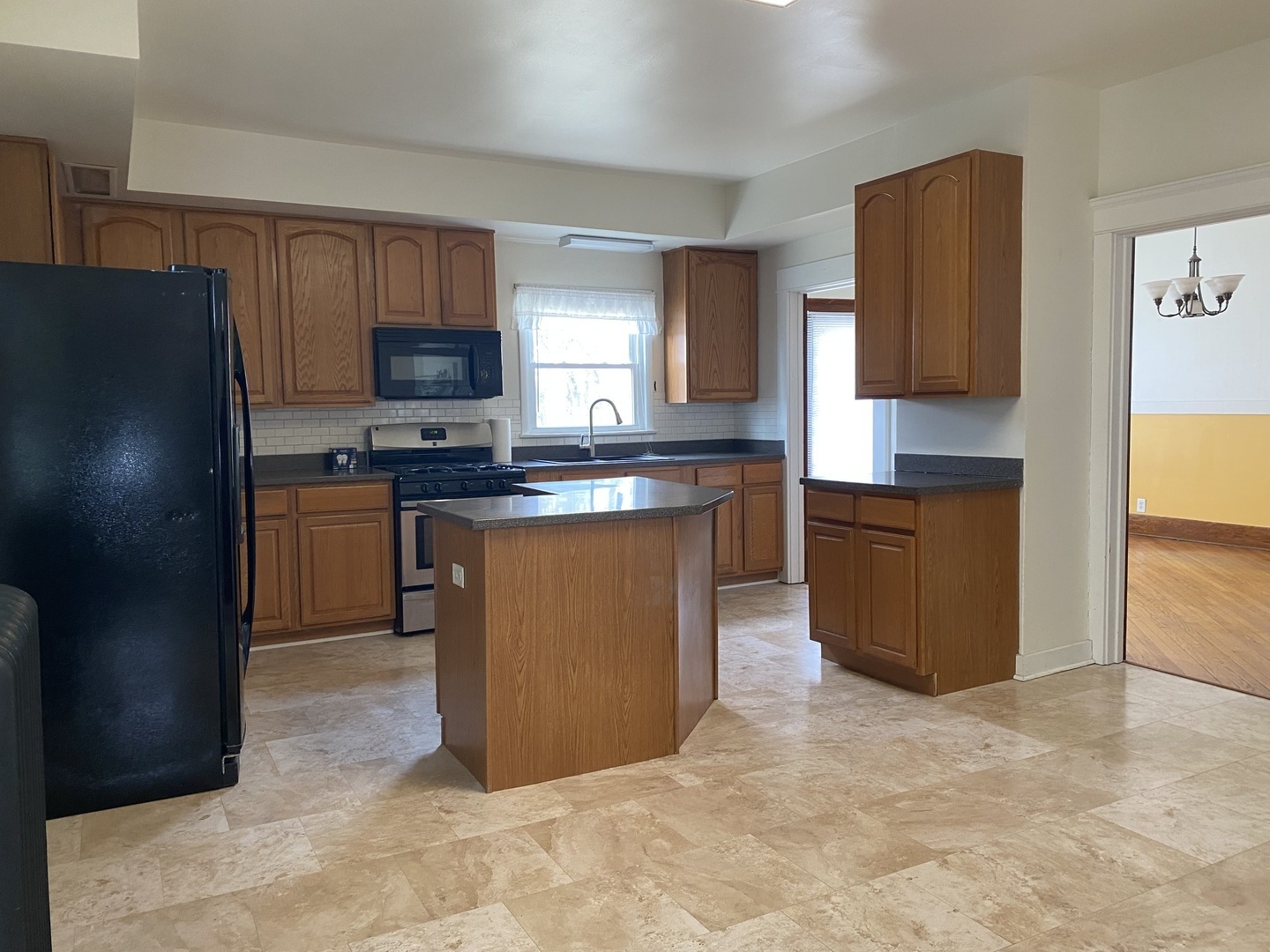 Undisclosed Address Maple Park, IL 60119 - Photo 8 of 27 a kitchen with stainless steel appliances granite countertop a stove a sink a refrigerator and a refrigerator