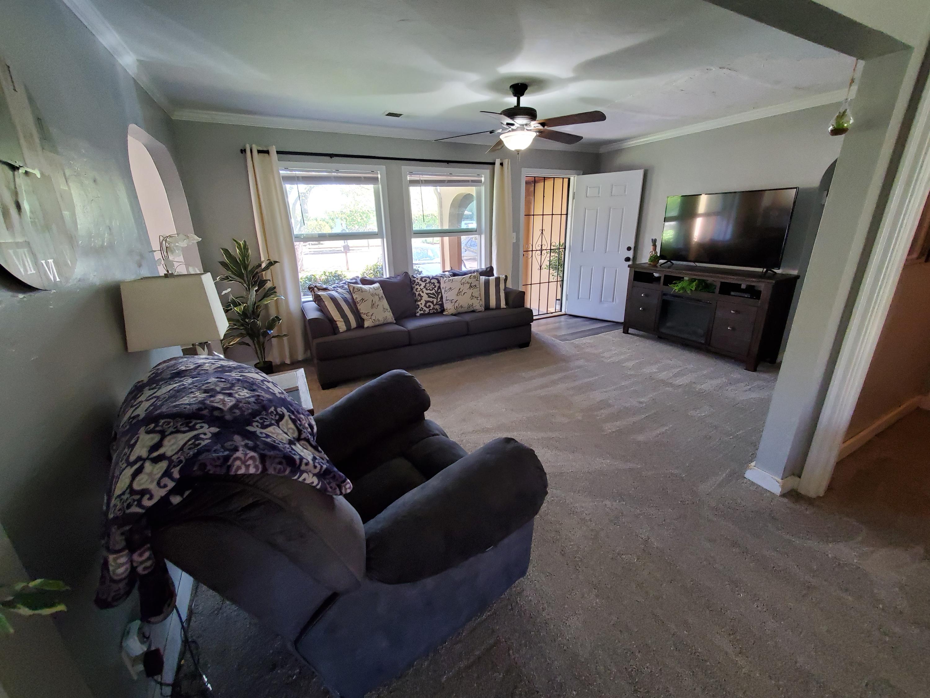 2476 California Street Redding, CA 96001 - Photo 13 of 32 a living room with furniture and a flat screen tv