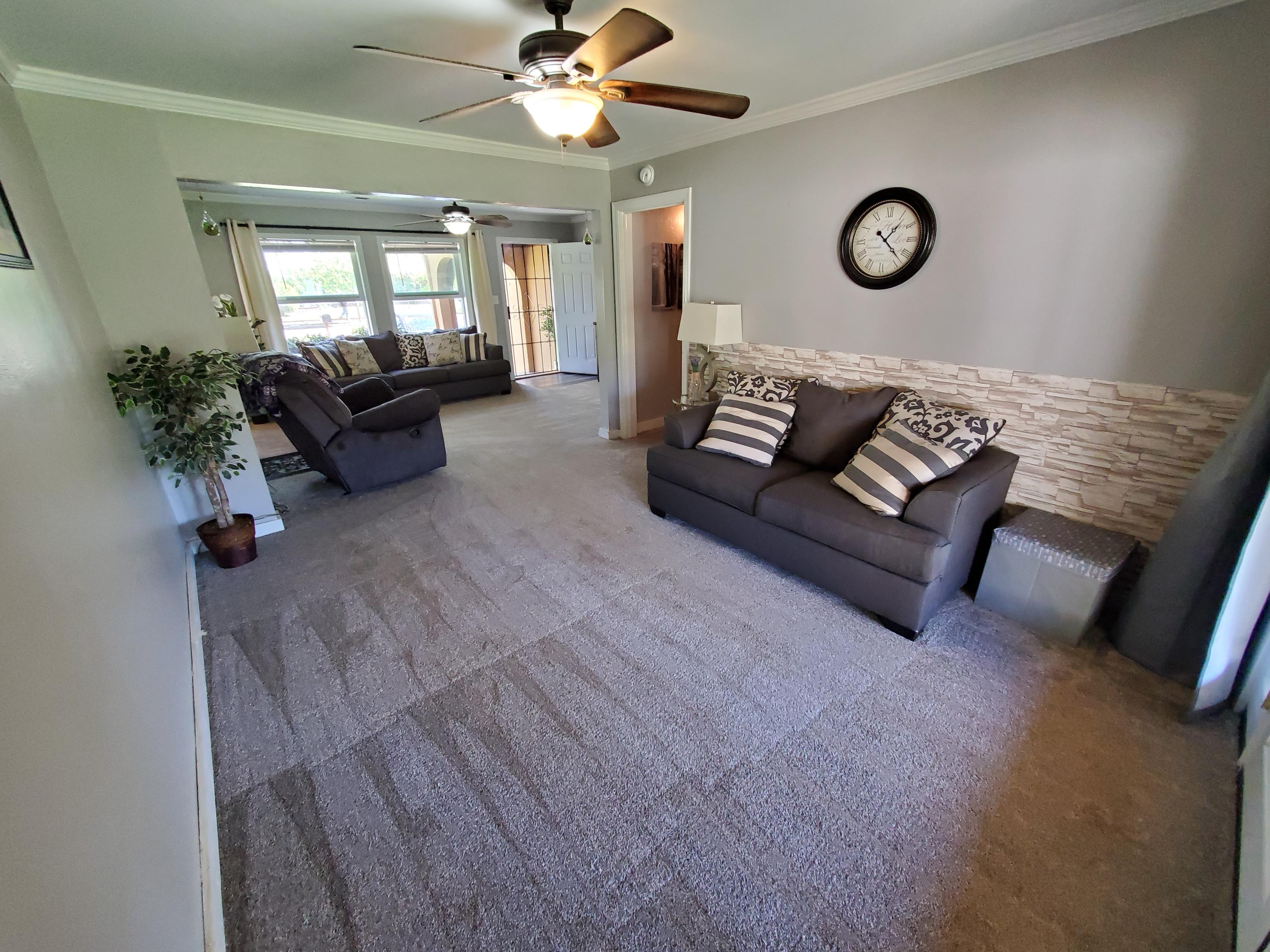 2476 California Street Redding, CA 96001 - Photo 14 of 32 a living room with furniture and a large window