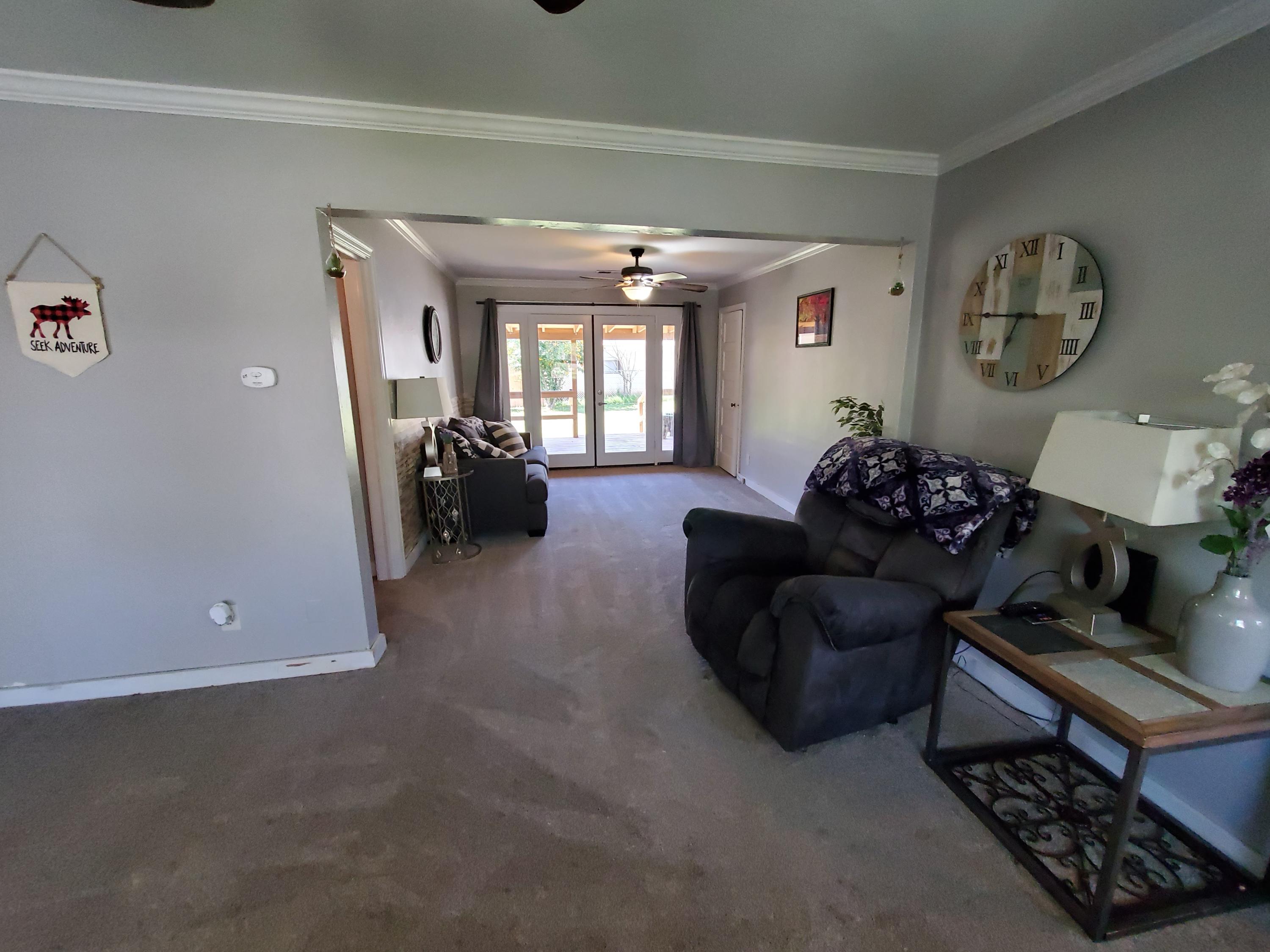 2476 California Street Redding, CA 96001 - Photo 16 of 32 a living room with furniture and a window