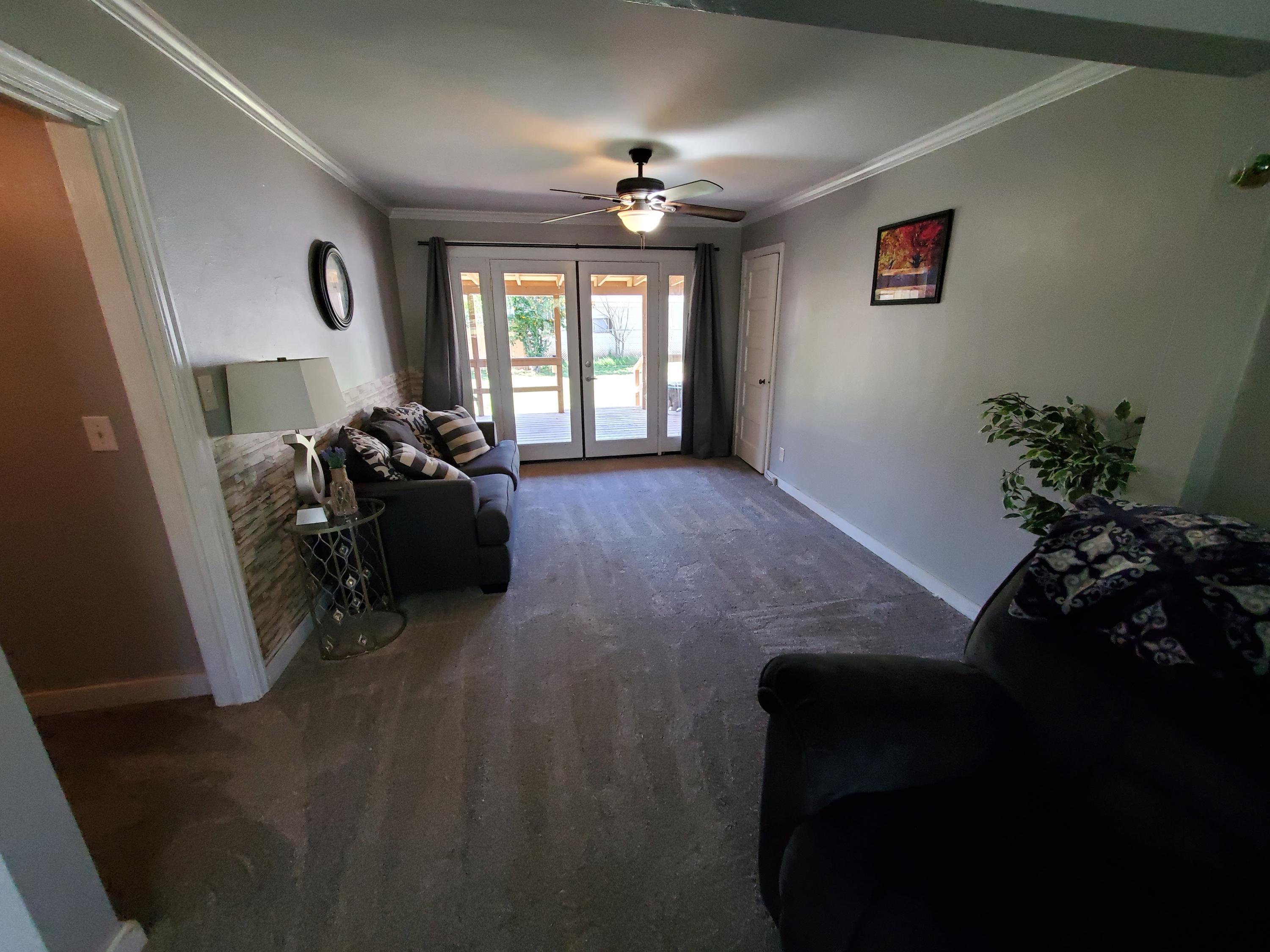 2476 California Street Redding, CA 96001 - Photo 17 of 32 a living room with furniture and a potted plant