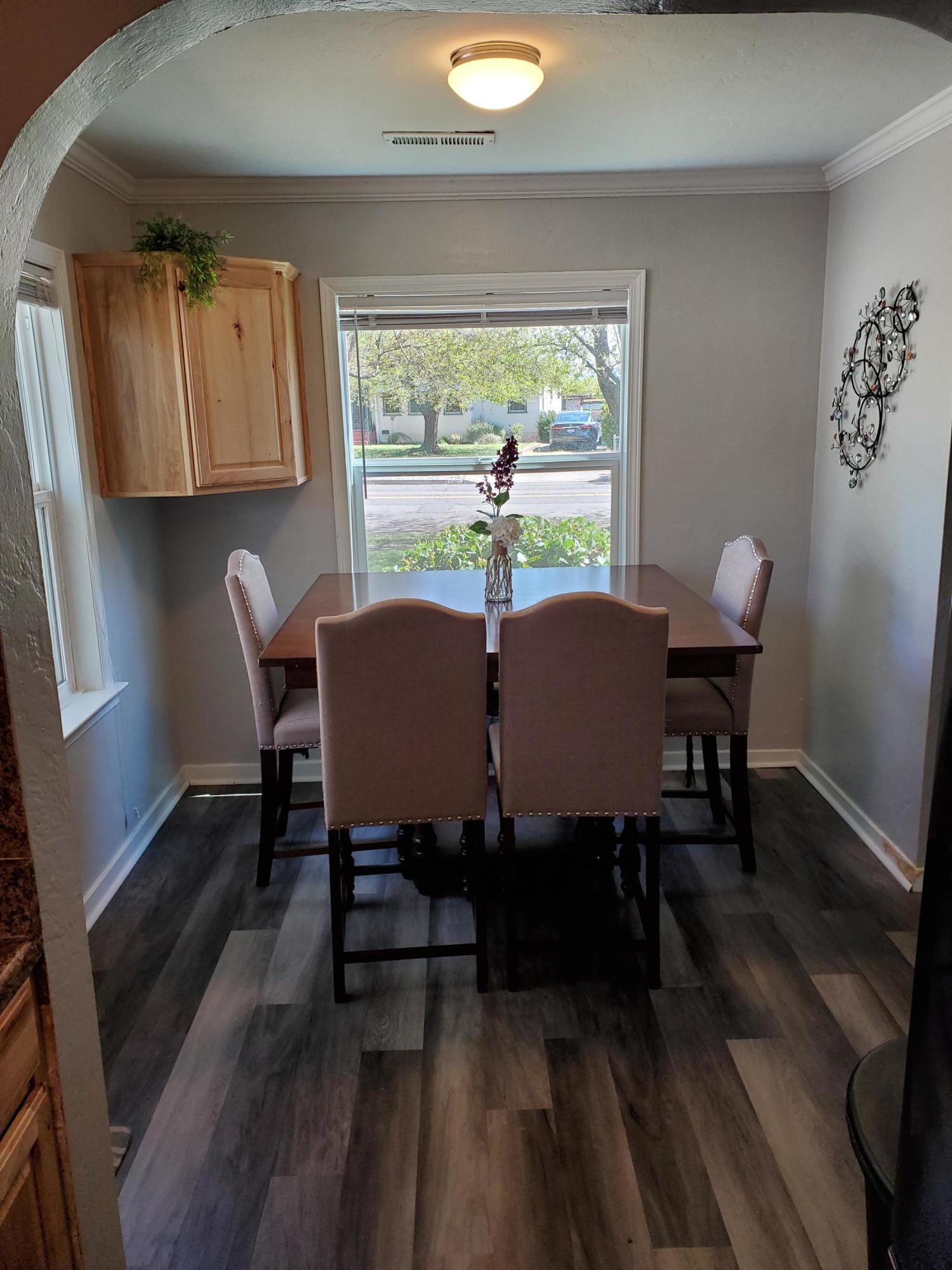 2476 California Street Redding, CA 96001 - Photo 19 of 32 a view of a dining room with furniture and wooden floor
