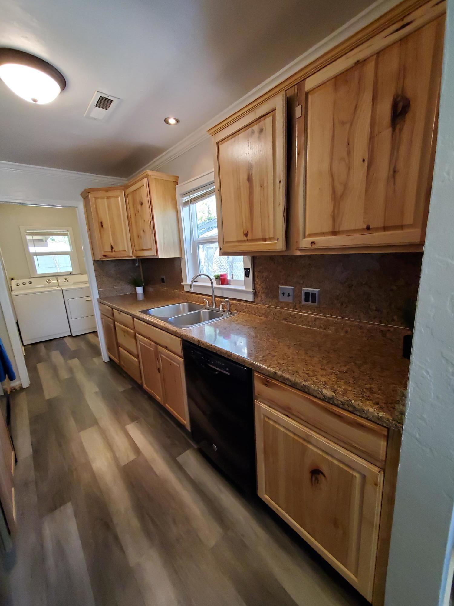 2476 California Street Redding, CA 96001 - Photo 26 of 32 a kitchen with stainless steel appliances a sink stove and cabinets
