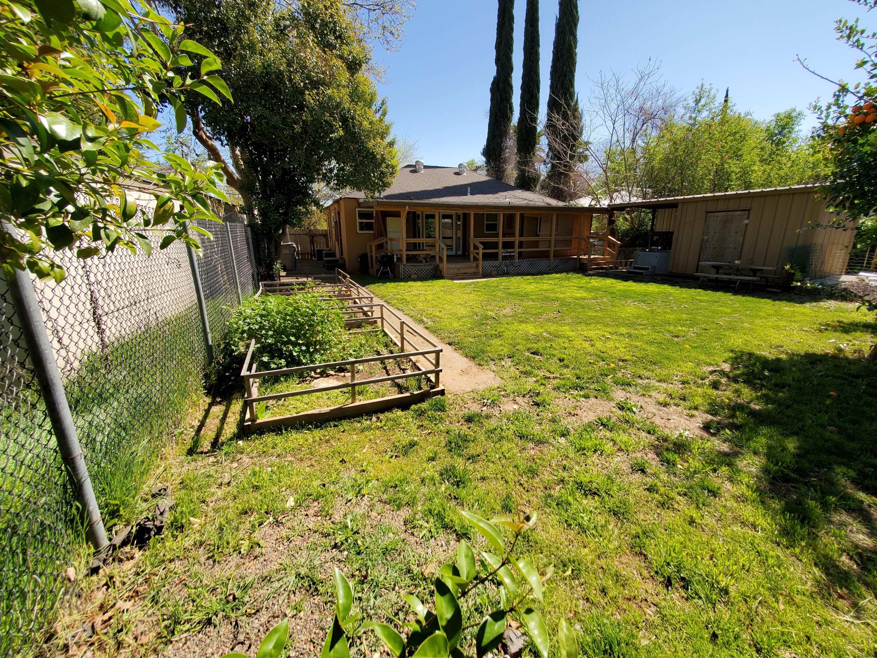 2476 California Street Redding, CA 96001 - Photo 4 of 32 a view of swimming pool with garden and trees