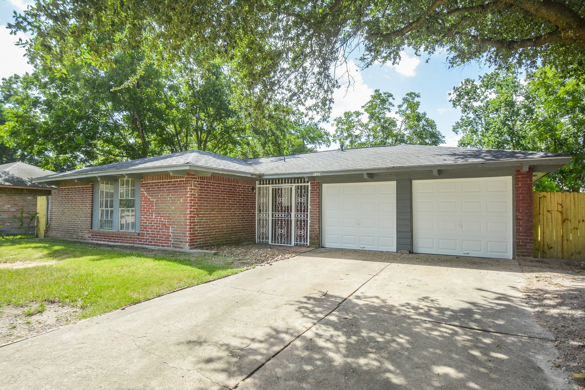 1339 Tarberry Road Houston, TX 77088 - Photo 4 of 18 Two-car garage with ample space for parking and storage.