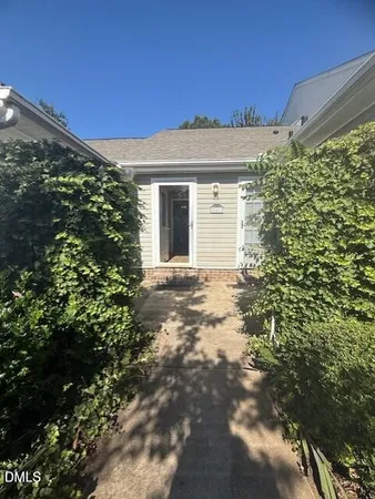 a view of a house with a tree