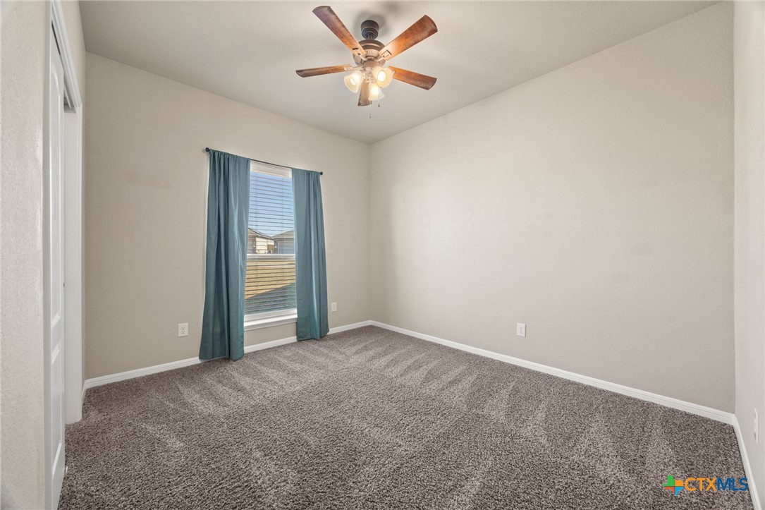 7617 Lee Hall Loop Temple, TX 76502 - Photo 17 of 26 an empty room with closet and fan
