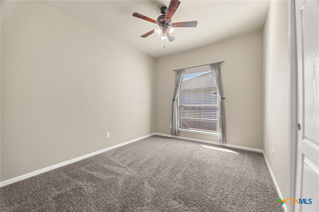 7617 Lee Hall Loop Temple, TX 76502 - Photo 18 of 26 an empty room with a window and a fan