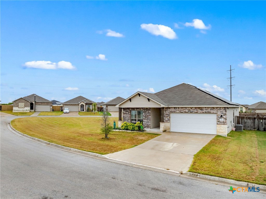 7617 Lee Hall Loop Temple, TX 76502 - Photo 4 of 26 a front view of a house with a yard