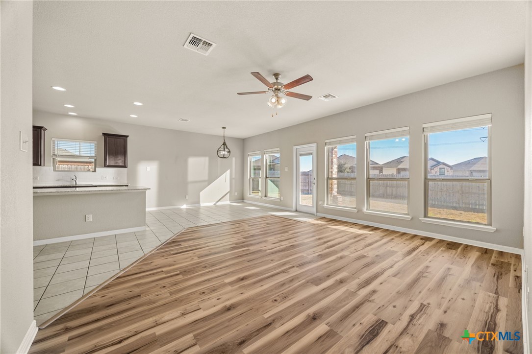 7617 Lee Hall Loop Temple, TX 76502 - Photo 7 of 26 a view of empty room with wooden floor and fan