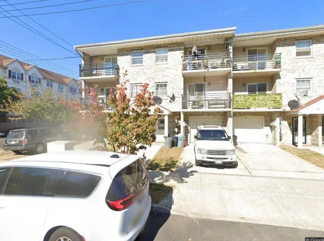 a bathroom with a sink and a shower curtain