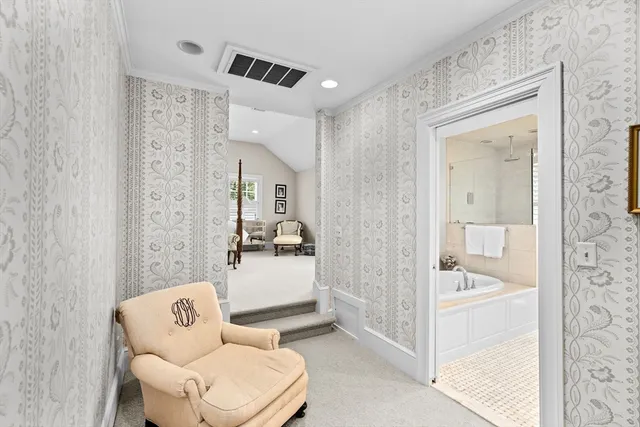 a bathroom with a tub shower and sink