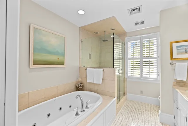 a bathroom with a bathtub and a shower