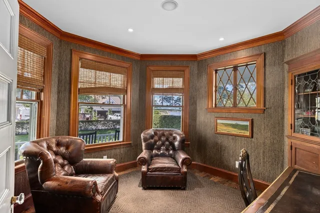 a living room with furniture and windows