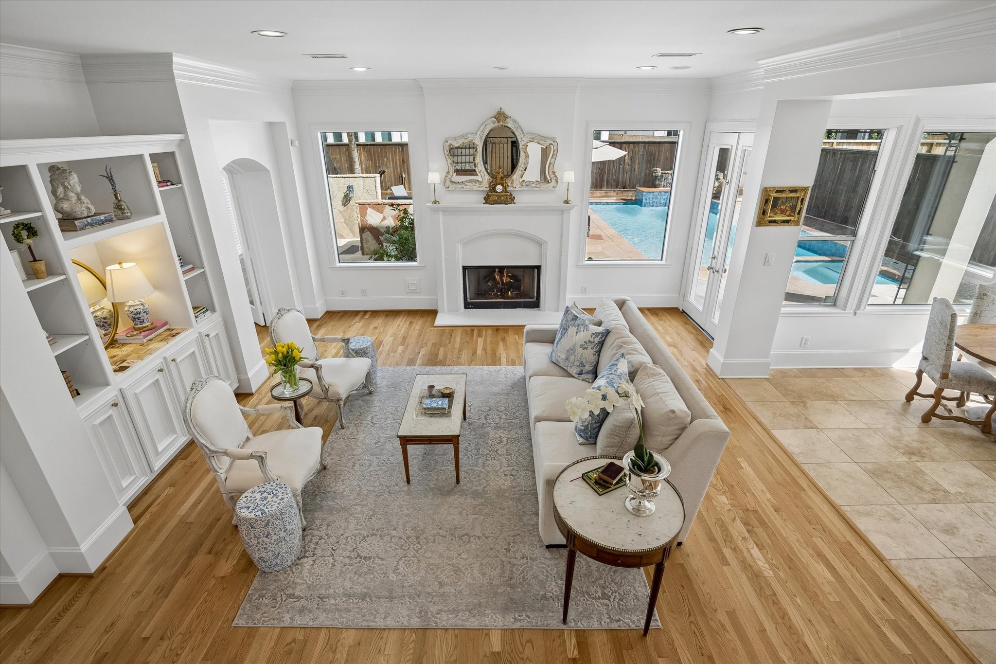 4606 Birch Street Bellaire, TX 77401 - Photo 12 of 45 a living room with furniture and a fireplace