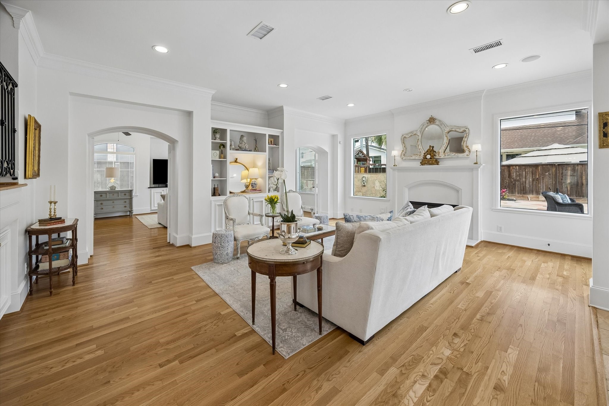 4606 Birch Street Bellaire, TX 77401 - Photo 13 of 45 a living room with furniture and a wooden floor