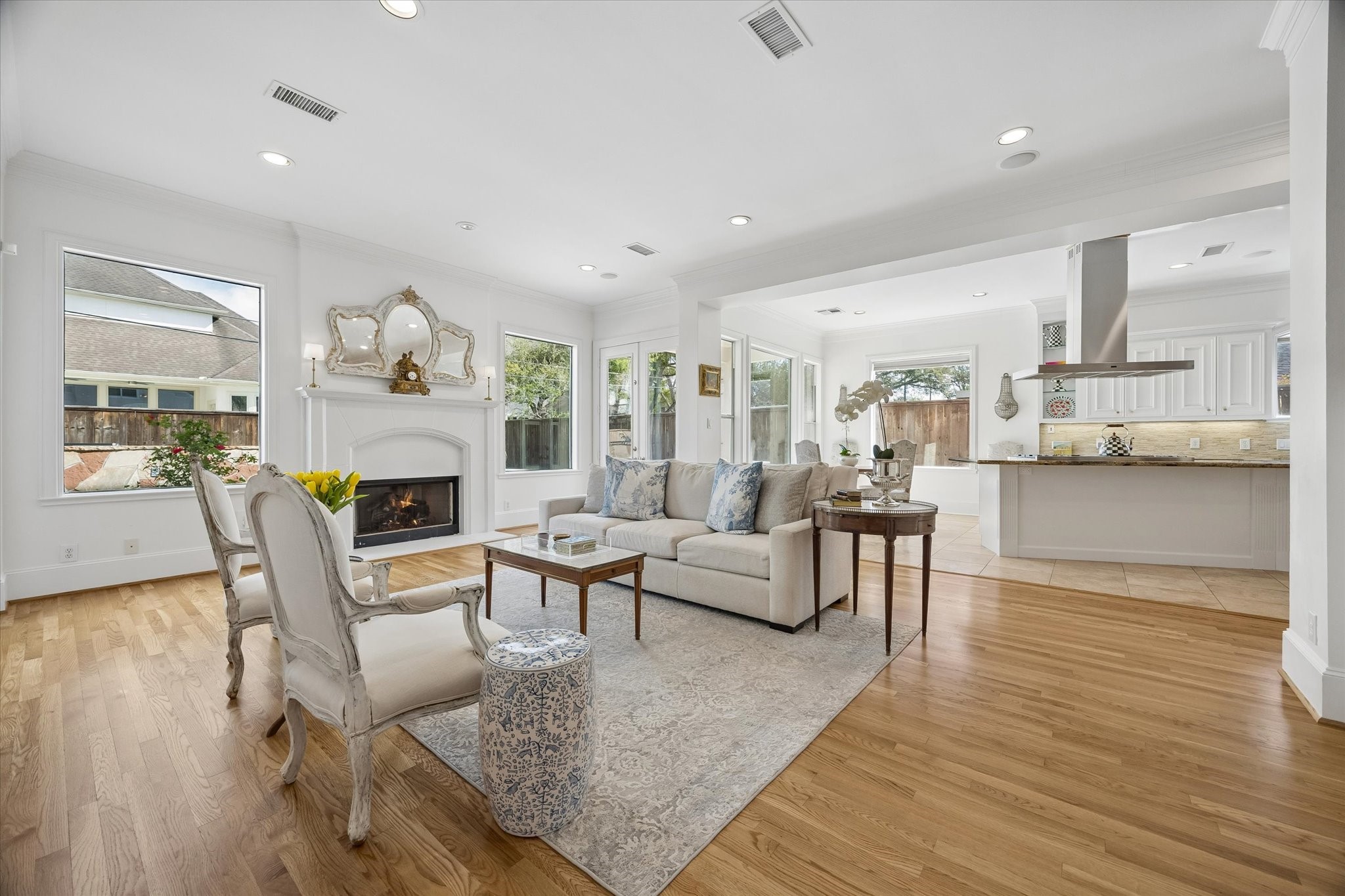 4606 Birch Street Bellaire, TX 77401 - Photo 14 of 45 a living room with fireplace furniture and a wooden floor