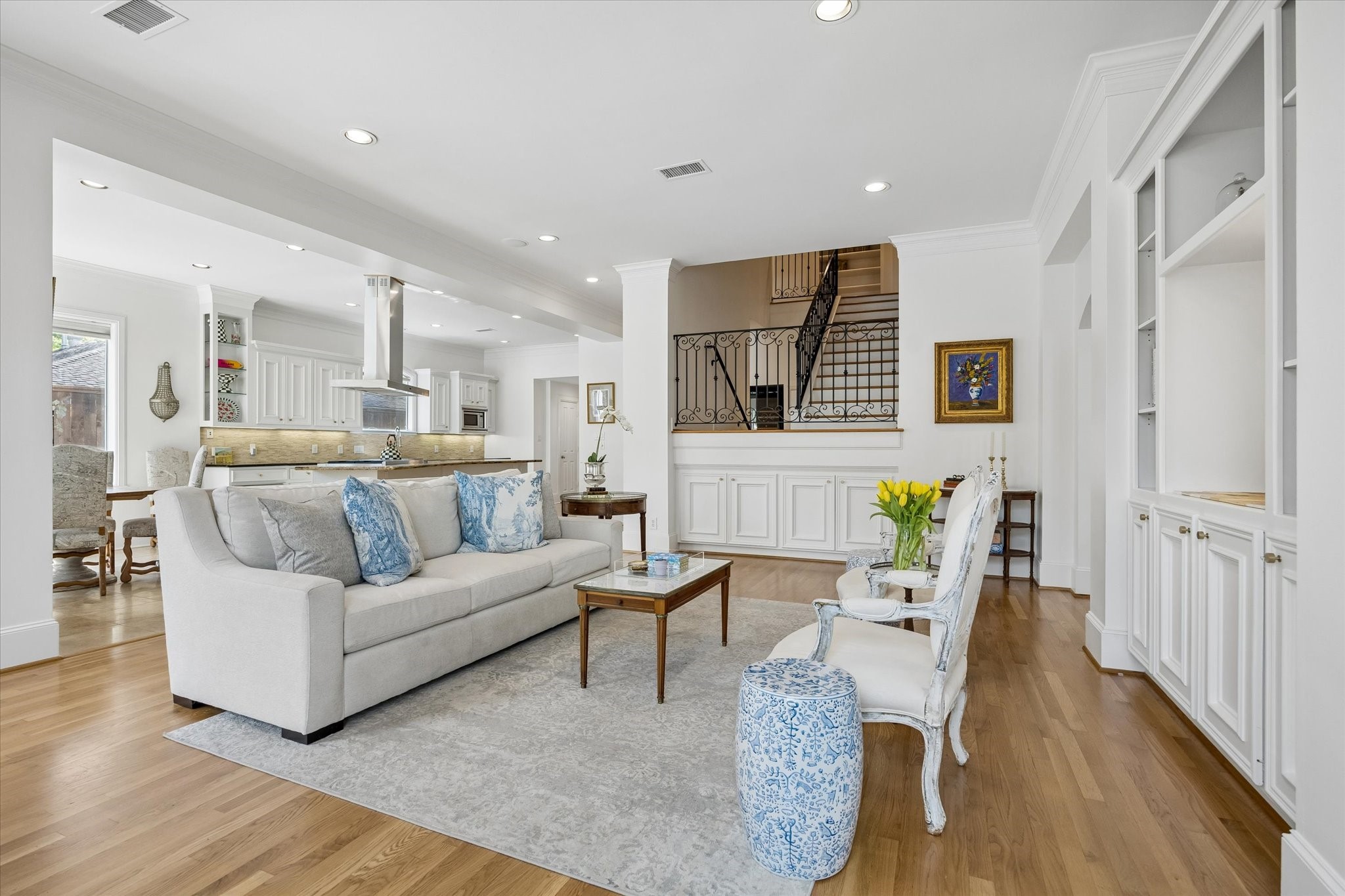 4606 Birch Street Bellaire, TX 77401 - Photo 15 of 45 a living room with furniture and a wooden floor