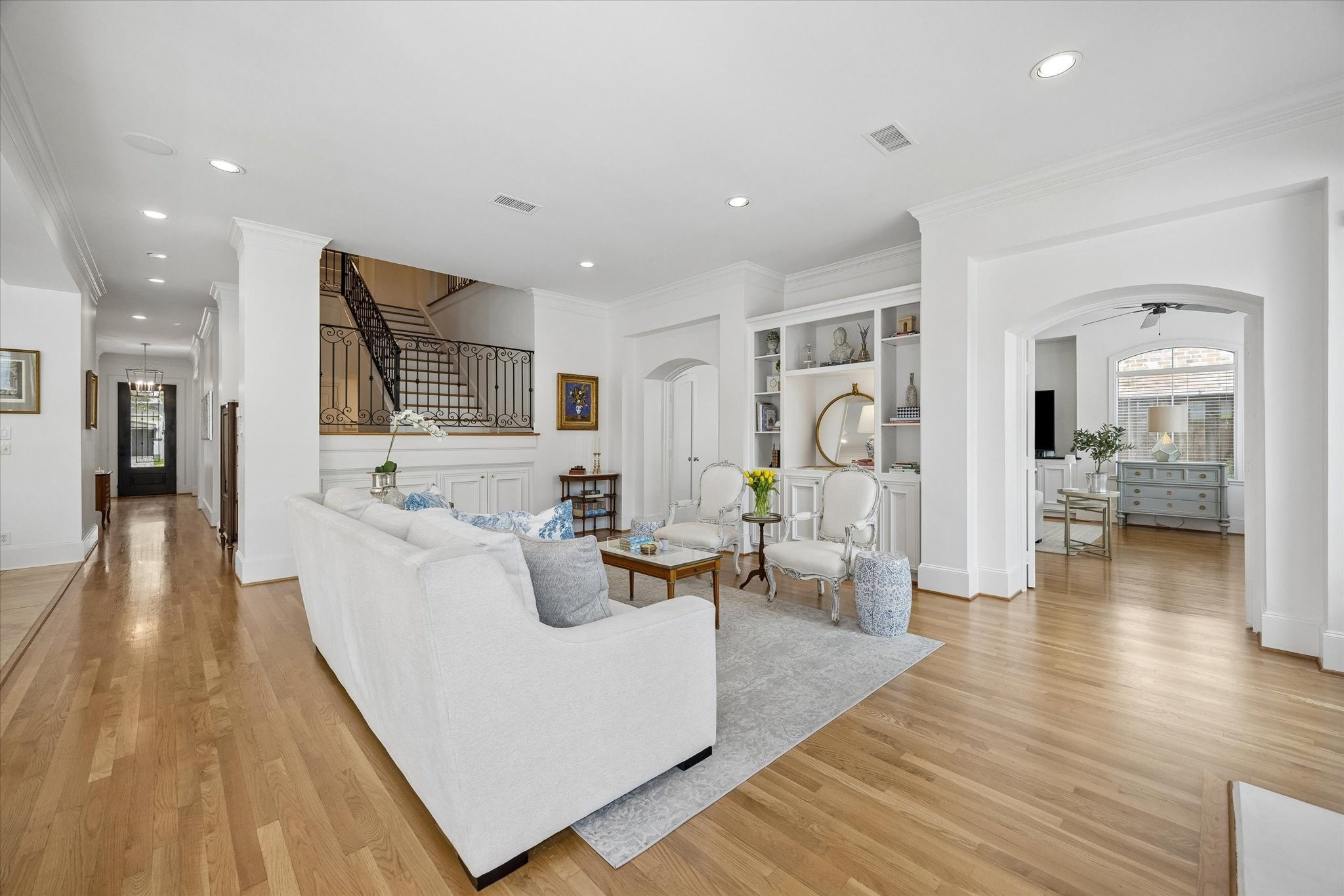 4606 Birch Street Bellaire, TX 77401 - Photo 16 of 45 a living room with furniture and wooden floor