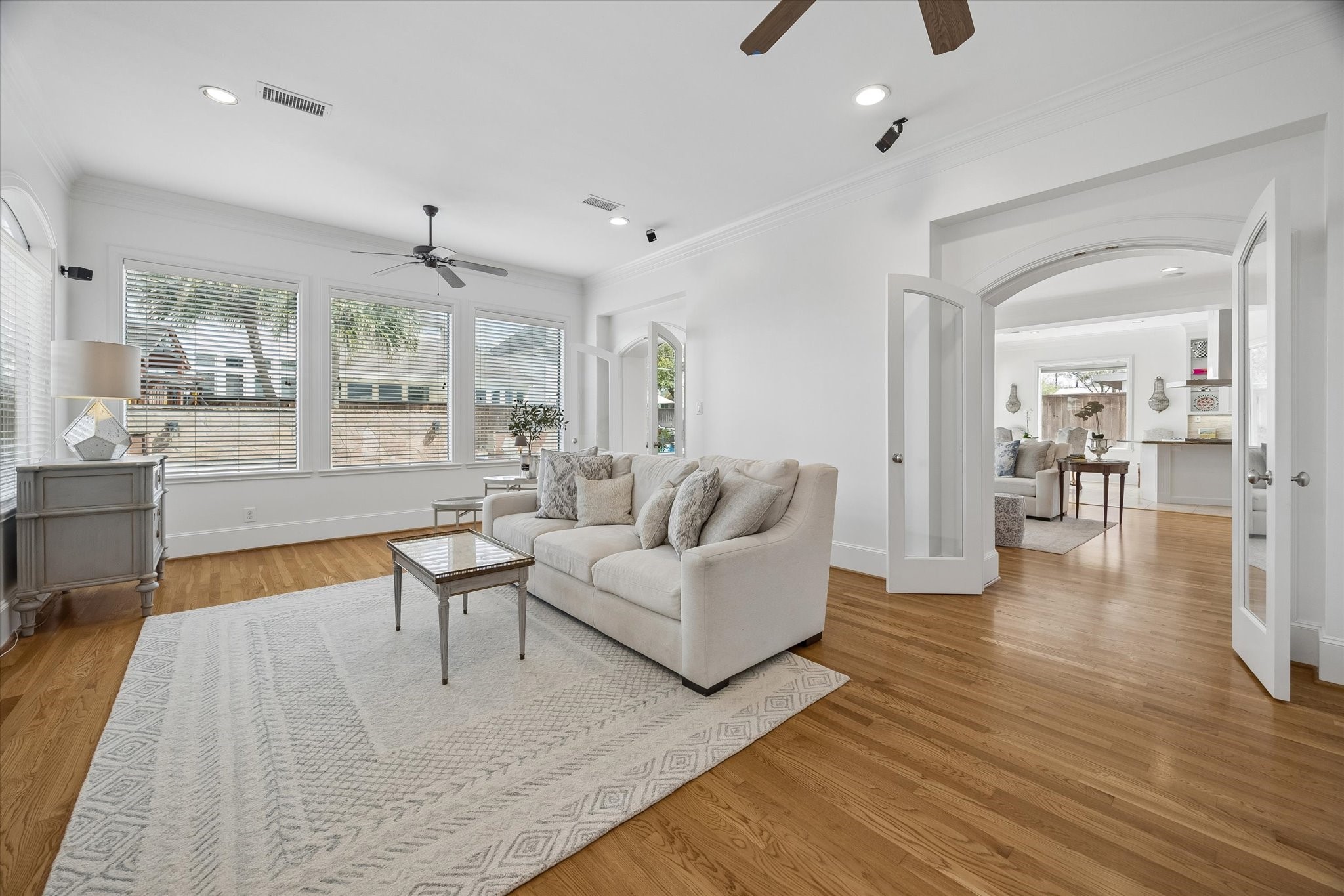 4606 Birch Street Bellaire, TX 77401 - Photo 17 of 45 a living room with furniture and a wooden floor