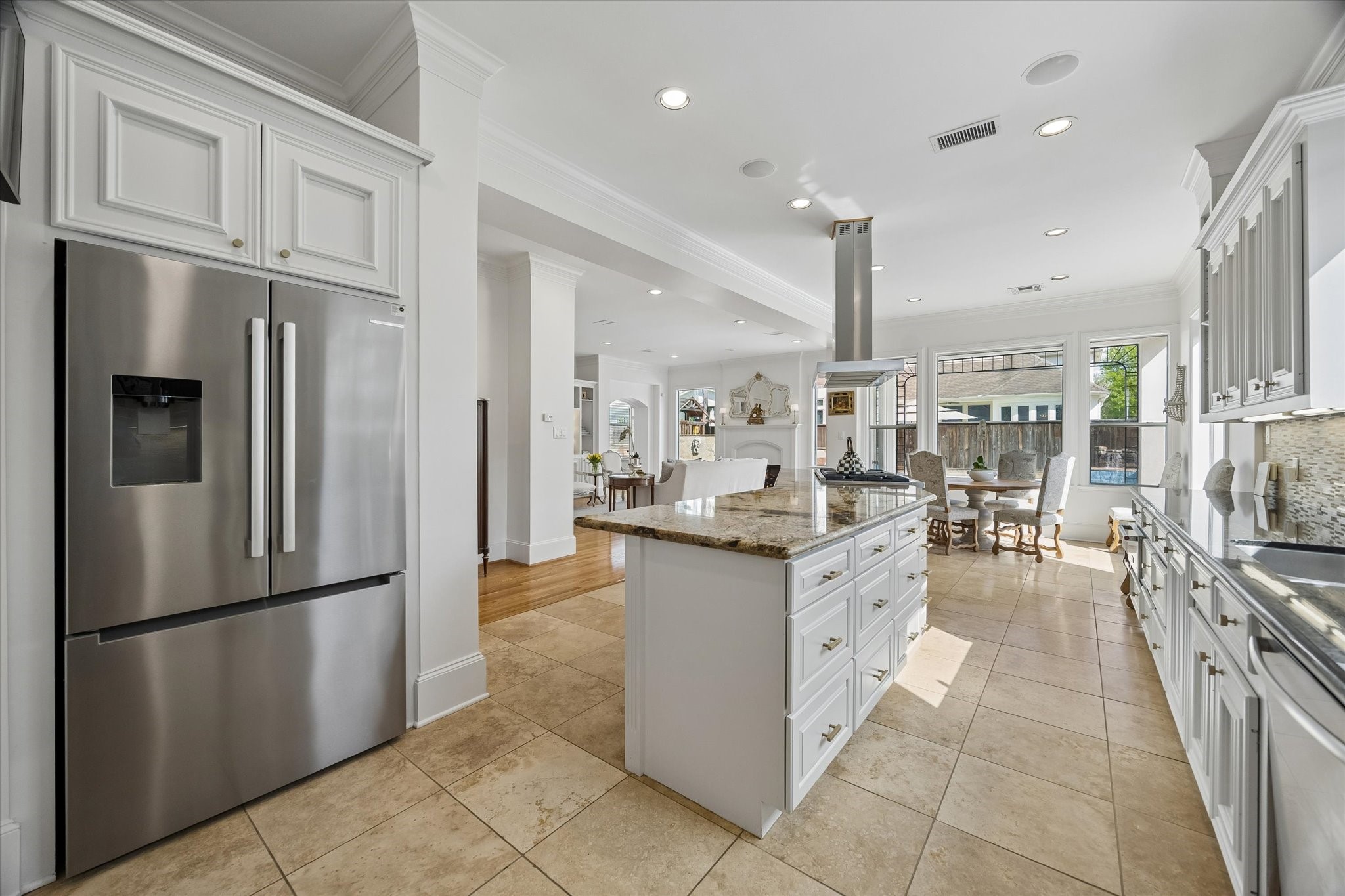4606 Birch Street Bellaire, TX 77401 - Photo 21 of 45 a kitchen with stainless steel appliances granite countertop a refrigerator oven a sink and dishwasher