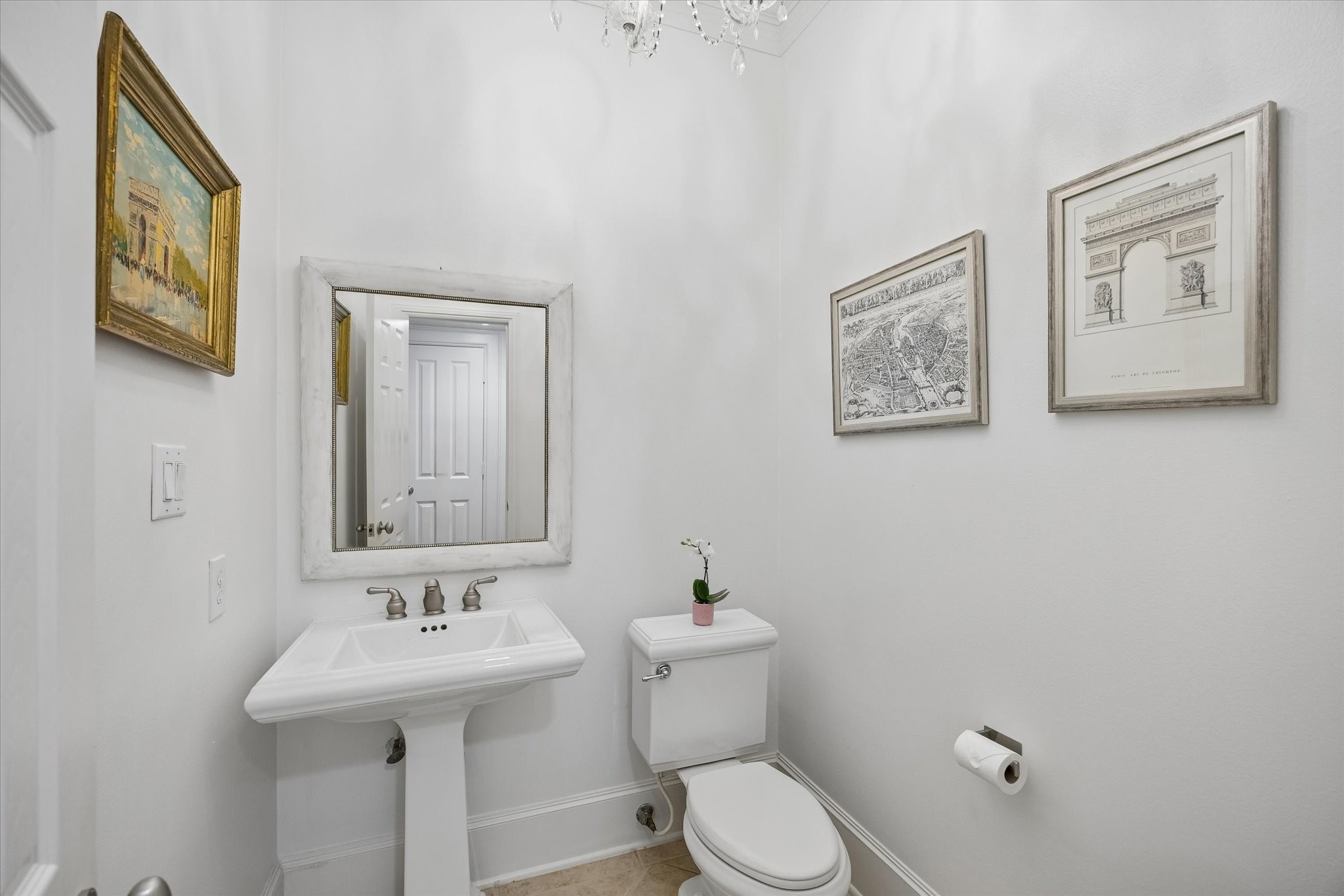 4606 Birch Street Bellaire, TX 77401 - Photo 24 of 45 a bathroom with a toilet sink and mirror