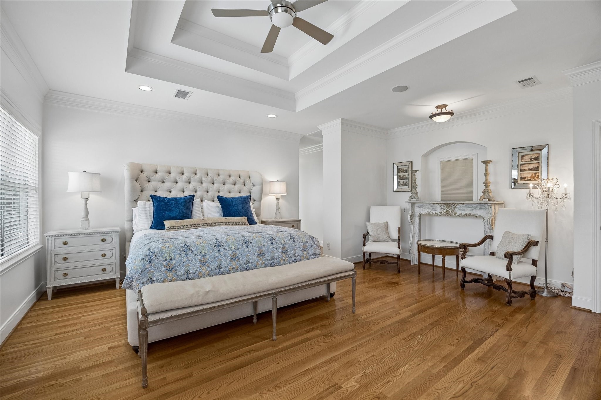 4606 Birch Street Bellaire, TX 77401 - Photo 26 of 45 a bedroom with a bed and wooden floor