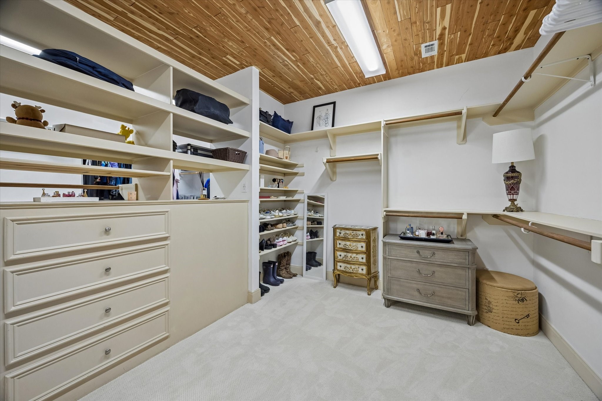 4606 Birch Street Bellaire, TX 77401 - Photo 30 of 45 a view of walk in closet with clothes and shoes