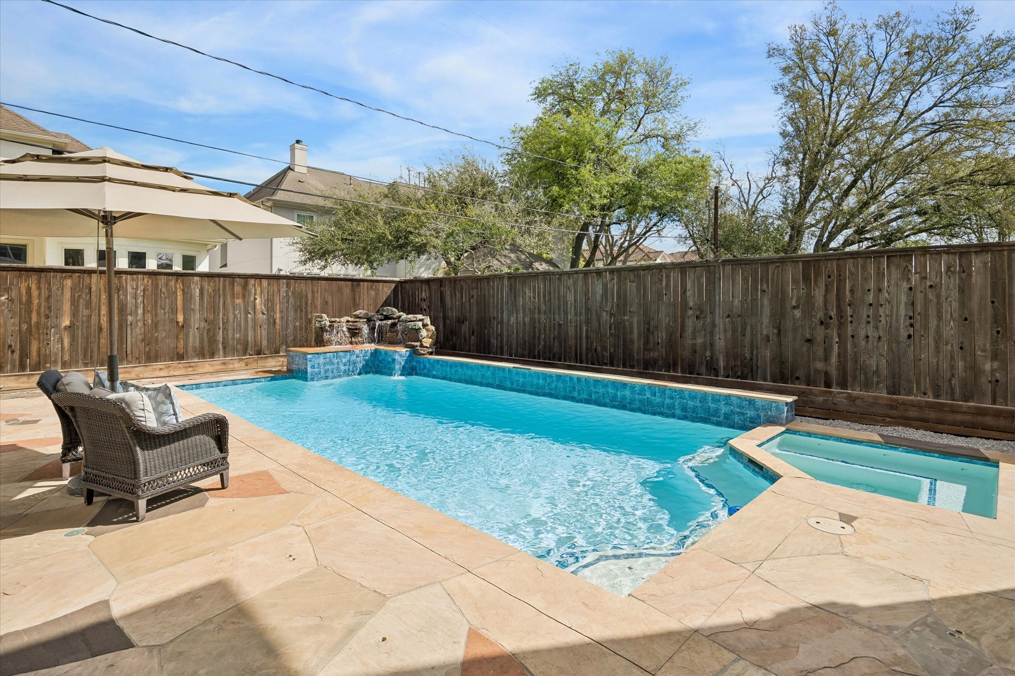 4606 Birch Street Bellaire, TX 77401 - Photo 40 of 45 a view of backyard with a chair and potted plants