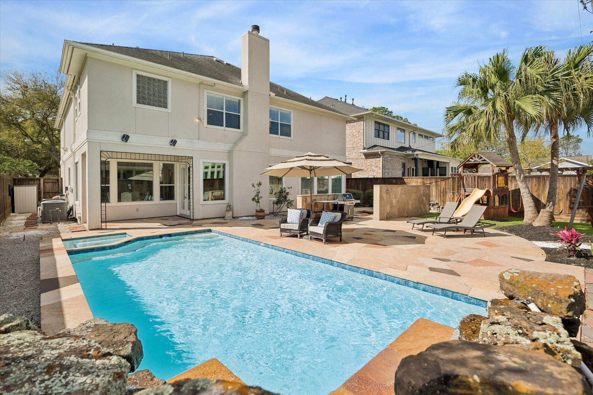 4606 Birch Street Bellaire, TX 77401 - Photo 41 of 45 a view of a house with backyard and sitting area