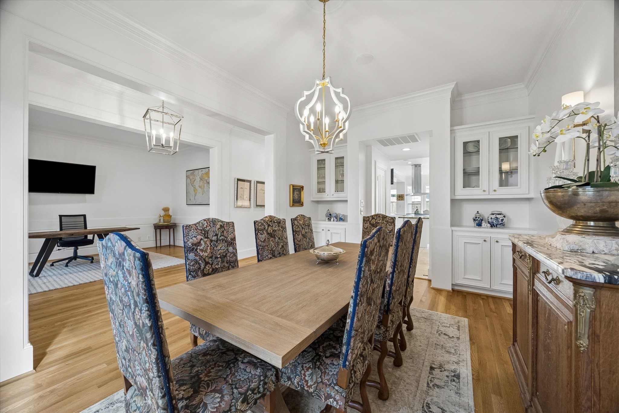 4606 Birch Street Bellaire, TX 77401 - Photo 7 of 45 a view of a dining room with furniture and wooden floor