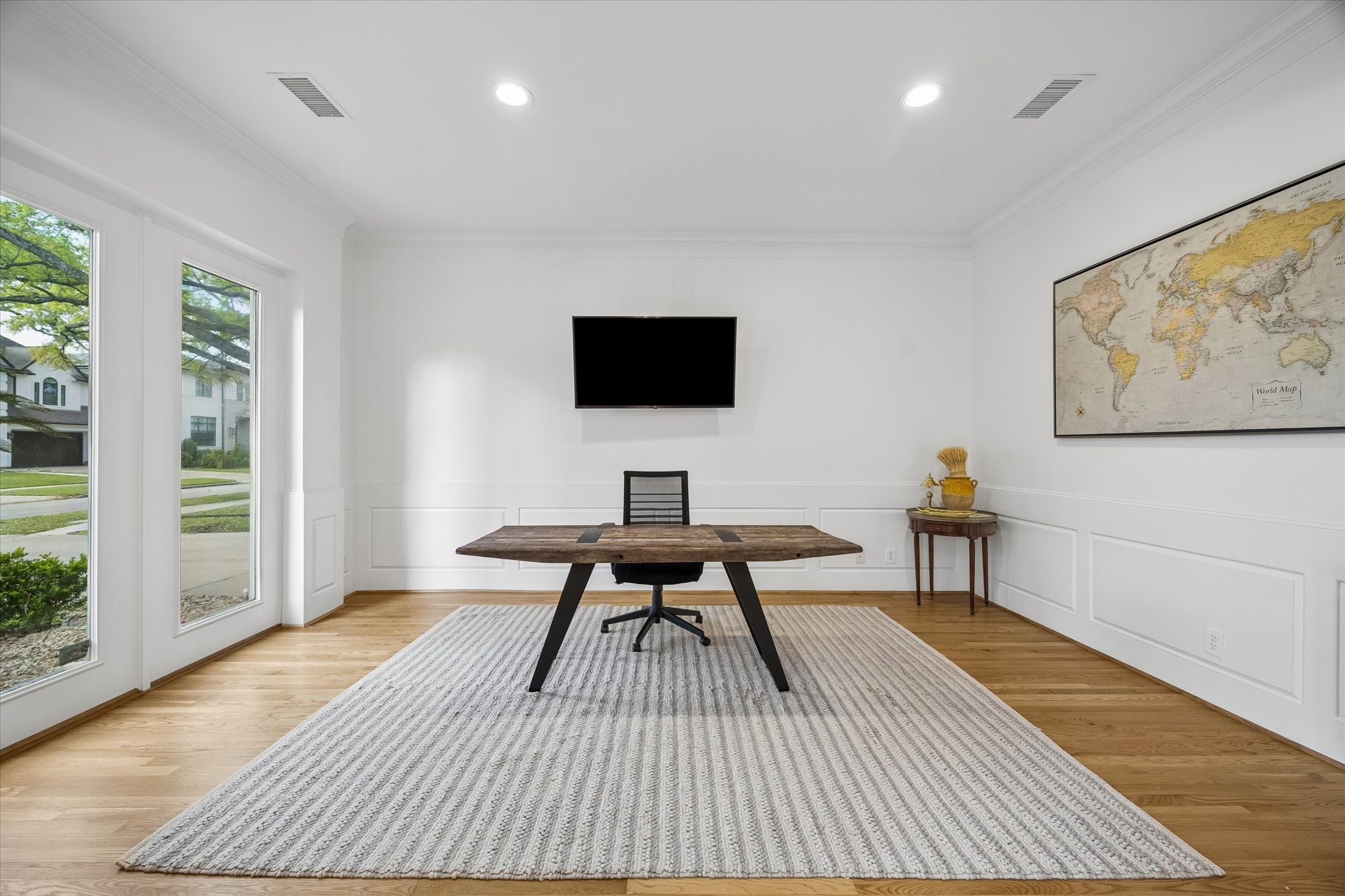 4606 Birch Street Bellaire, TX 77401 - Photo 8 of 45 a view of a workspace with furniture and a window