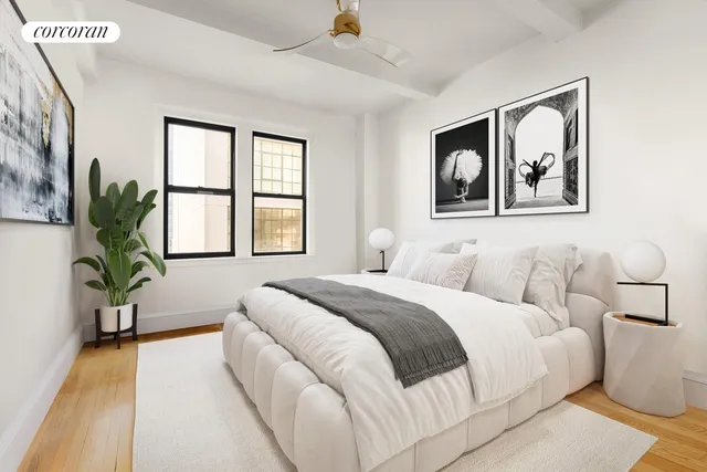 a living room with furniture a mirror and a table