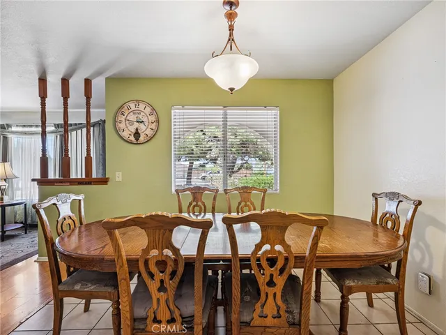 a view of a dining room with furniture and window